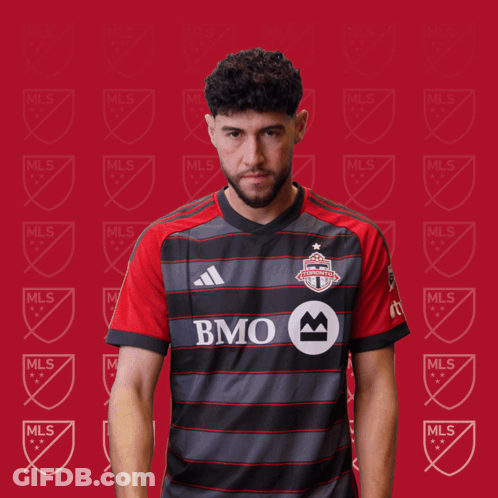 A Man In A Bmo Jersey Holds A Red Card GIF
