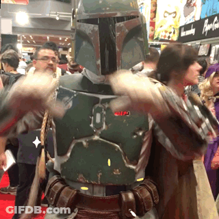 A Man In A Boba Fett Costume Stands In Front Of A Crowd GIF