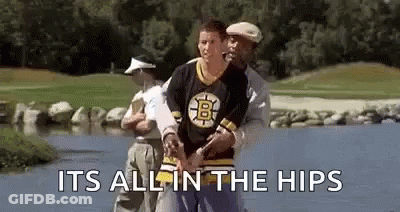 A Man In A Boston Bruins Jersey Is Standing Next To A Man In A White Hat . GIF