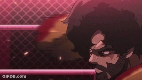 A Man In A Boxing Ring Has Blood Coming Out Of His Face GIF
