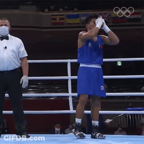 A Man In A Boxing Ring Wearing A Mask And Gloves GIF