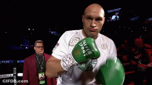 A Man In A Boxing Ring Wearing A Shirt That Says Mgm Grand On It GIF