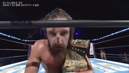 A Man In A Boxing Ring With A Belt That Says ' G1 Climax 32 ' On It GIF