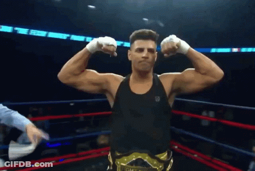 A Man In A Boxing Ring With A Belt That Says Gm GIF