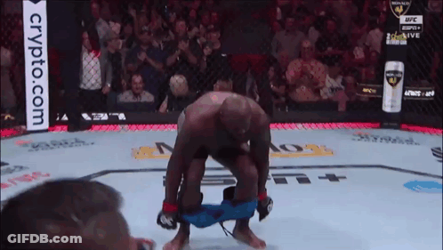 A Man In A Boxing Ring With A Crypto.com Advertisement In The Background GIF