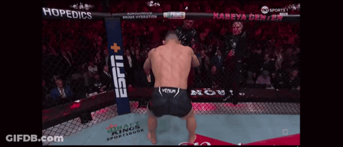 A Man In A Boxing Ring With A Espn Banner Behind Him GIF