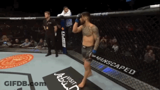 A Man In A Boxing Ring With A Sign That Says Visit Abdul GIF