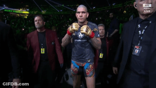 A Man In A Boxing Ring With A Ufc Logo On His Arm GIF