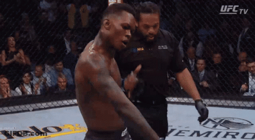 A Man In A Boxing Ring With A Ufc Tv Logo In The Corner GIF