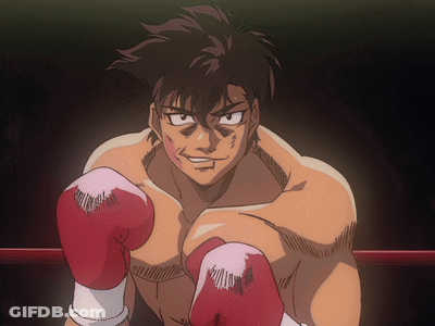 A Man In A Boxing Ring With Red Boxing Gloves On GIF
