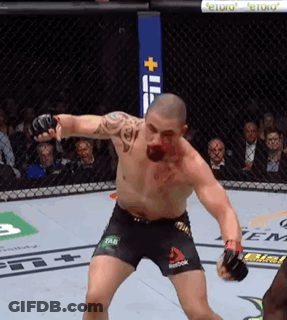 A Man In A Boxing Ring With Reebok Shorts On His Shorts GIF
