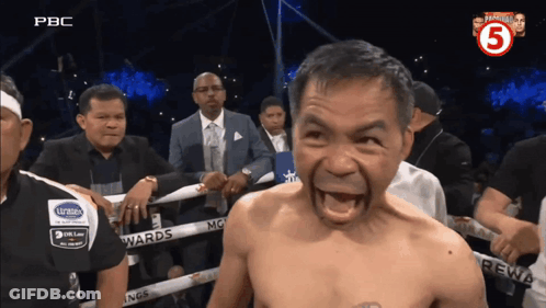 A Man In A Boxing Ring With The Number 5 On The Corner GIF