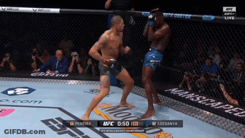 A Man In A Boxing Ring With The Ufc Logo On The Side GIF