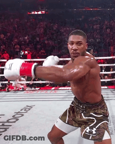A Man In A Boxing Ring With The Word Aerotax On The Floor GIF