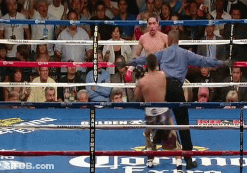 A Man In A Boxing Ring With The Word Corona On The Ring GIF