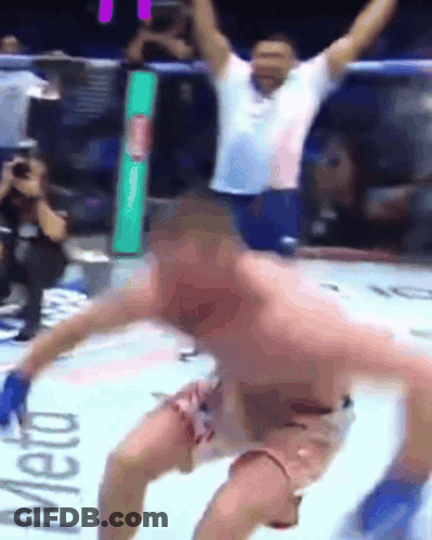 A Man In A Boxing Ring With The Word Meto On The Wall GIF