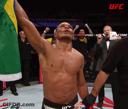A Man In A Boxing Ring With The Word Ufc In The Background GIF