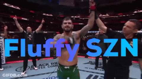 A Man In A Boxing Ring With The Words Fluffy Szn In Blue Letters GIF