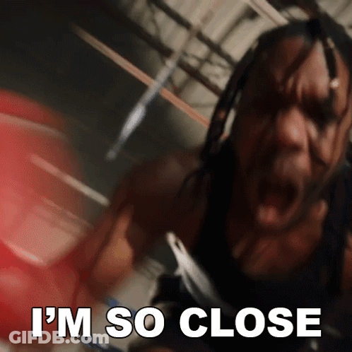 A Man In A Boxing Ring With The Words " I 'M So Close " Above Him GIF