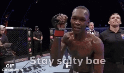 A Man In A Boxing Ring With The Words " Stay Salty Bae " On The Bottom GIF