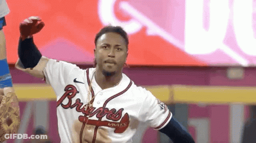 A Man In A Braves Jersey Throws A Ball GIF