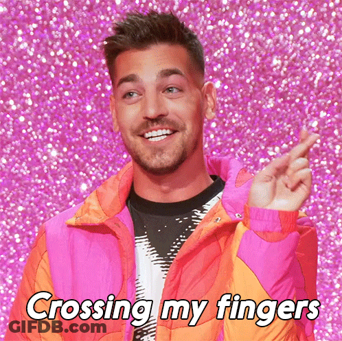 Man In Pink Jacket Crossing Fingers GIF