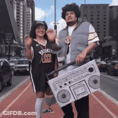 A Man In A Brooklyn Jersey Holds A Boom Box GIF