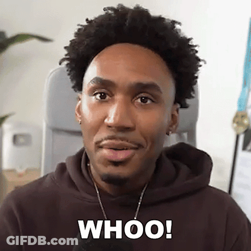 A Man In A Brown Hoodie Is Making A Funny Face And Saying Whoo ! GIF