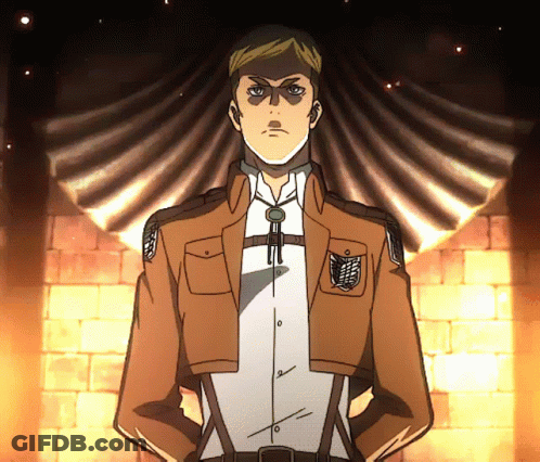 A Man In A Brown Jacket And White Shirt Stands With His Hands On His Hips In Front Of A Brick Wall GIF