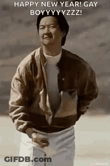 A Man In A Brown Jacket Is Standing In Front Of A Sign That Says Happy New Year ! GIF