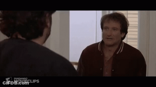 A Man In A Brown Jacket Is Talking To Another Man In A Movie Clip GIF