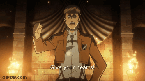 A Man In A Brown Jacket Stands In Front Of A Brick Wall And Says " Give Your Hearts " GIF