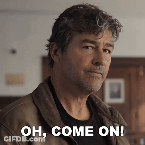A Man In A Brown Jacket With The Words Oh Come On Behind Him GIF
