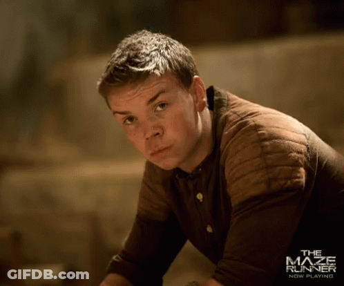 A Man In A Brown Shirt With The Maze Runner New Beginning Written On The Bottom GIF