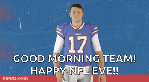 A Man In A Buffalo Bills Jersey Is Waving His Hand GIF