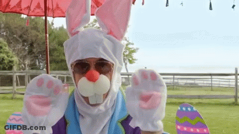 A Man In A Bunny Costume Is Holding A Skateboard And Easter Eggs . GIF
