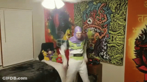 A Man In A Buzz Lightyear Costume Is Dancing In A Room GIF