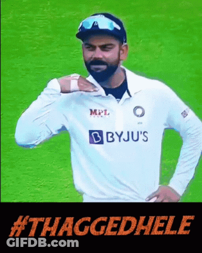 A Man In A Byju 'S Shirt Is Standing On A Field GIF