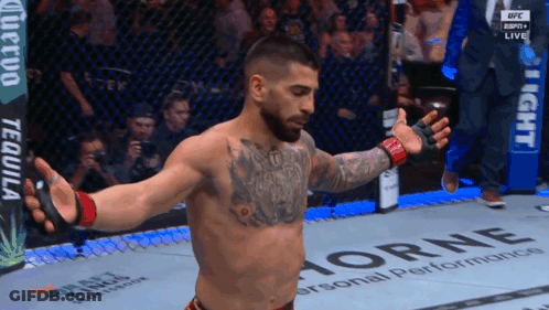 A Man In A Cage With A Banner That Says Horne On It GIF
