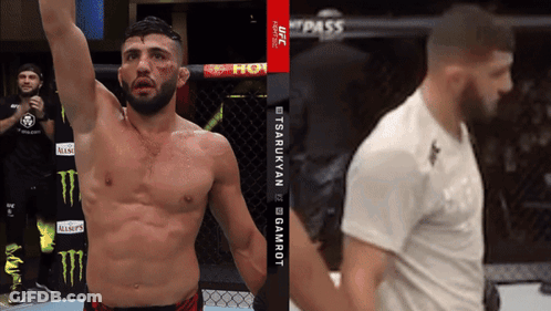 A Man In A Cage With A Monster Energy Logo On The Wall GIF