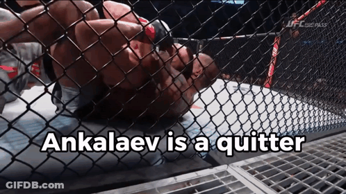 A Man In A Cage With The Words " Ankalaev Is A Quitter " On The Bottom GIF