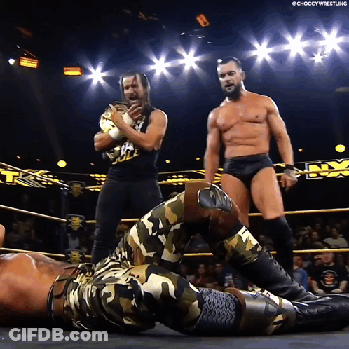 A Man In A Camo Outfit Is Laying On The Ground In A Ring GIF