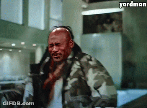 A Man In A Camouflage Jacket Has Blood On His Face And The Words Yardman Above Him GIF