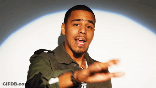 A Man In A Camouflage Jacket Is Reaching Out His Hand GIF