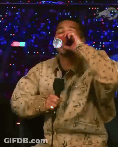Man Singing Into Microphone With Red Bull Logo GIF