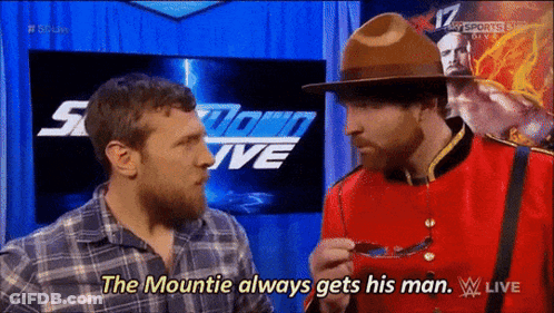 A Man In A Canadian Uniform Is Talking To Another Man In A Plaid Shirt GIF