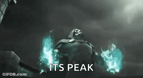 A Man In A Cape Is Holding A Fireball In His Hands And Says `` Its Peak '' . GIF