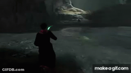 A Man In A Cape Is Holding A Green Light In His Hand . GIF