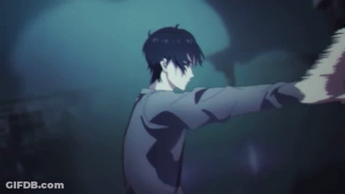 A Man In A Cape Is Standing In A Dark Room With A Hand On His Head . GIF