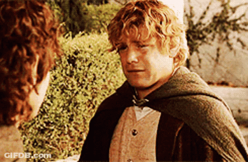 A Man In A Cape Talks To Another Man GIF